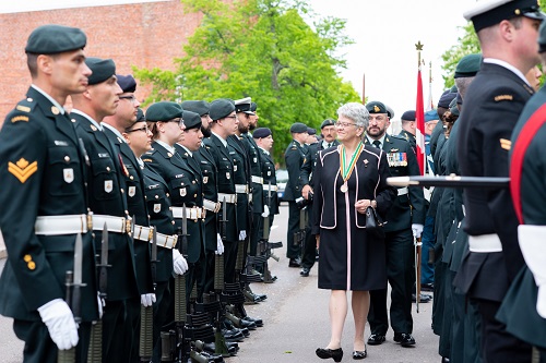 Her Honour, Antoinette Perry, inspects the honour guard.